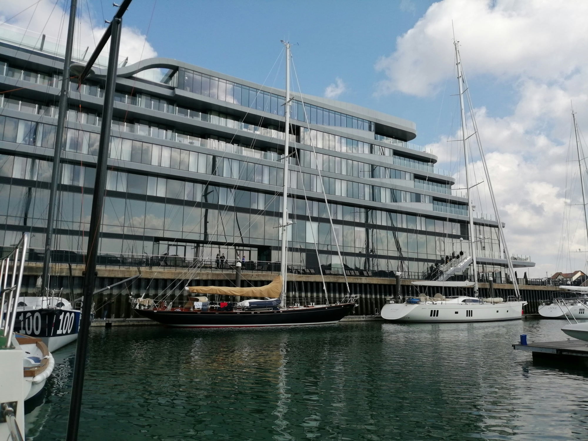 Yachts alongside the glass waterfront at Ocean Village in Southampton