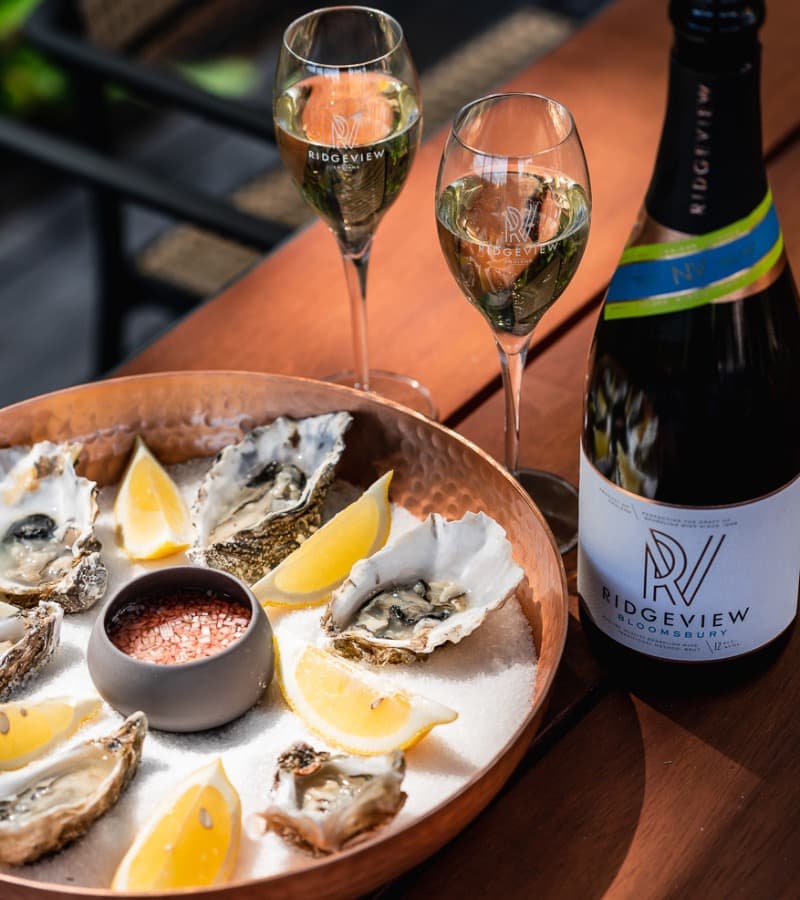 Oysters and sparkling wine on a wooden table