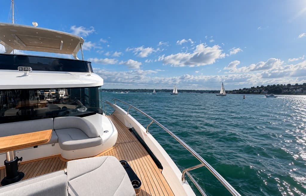 The deck of a yacht looking out across the water