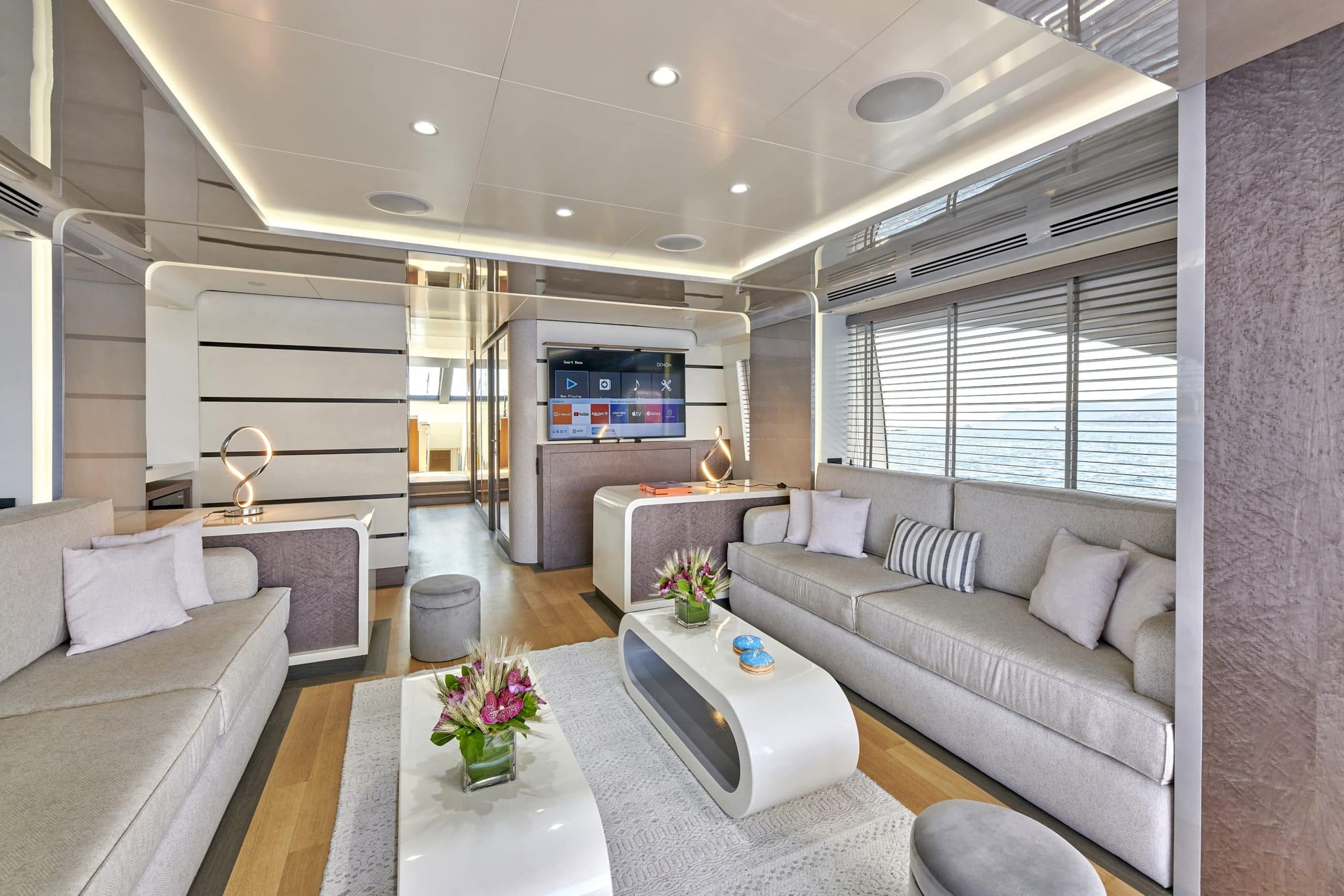 Saloon interior of a motor yacht, looking towards the windows